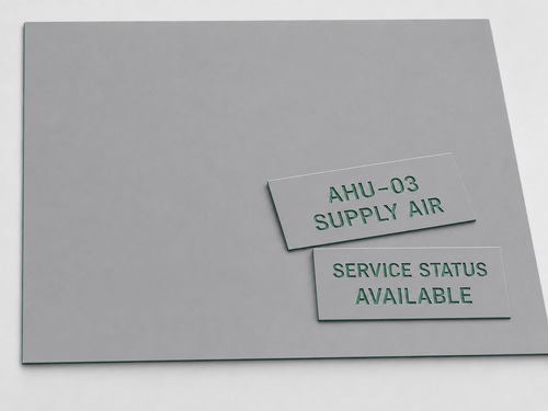 LYS-7016 building service identification engraving laminate with thin matte gray face continuous green core and recessed HVAC labels