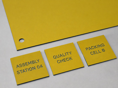 LYS-7019 workshop station identification engraving laminate with thin matte yellow face continuous dark navy core and slightly recessed navy wording