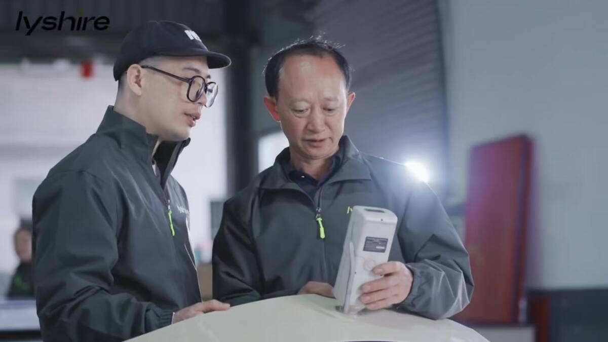 LYSHIRE technicians checking engraving plastic color consistency during sheet production