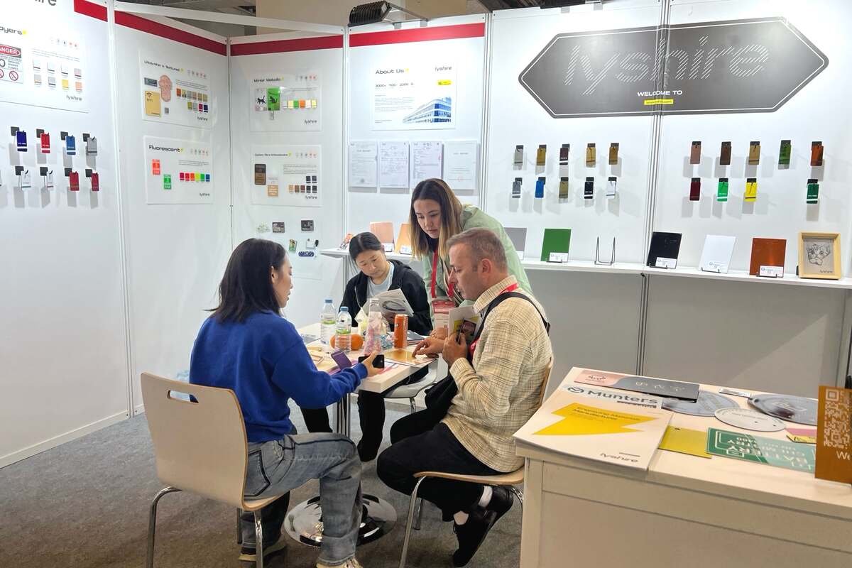 LYSHIRE team discussing engraving sheet requirements with a buyer at SIGN Istanbul 2025