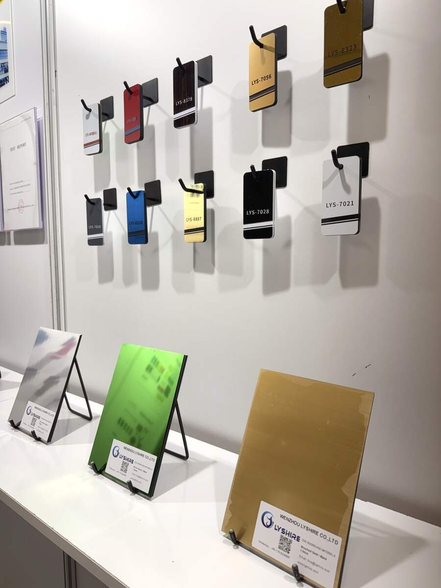 LYSHIRE engraving sheet color samples and metallic surface panels displayed at SIGN Istanbul 2025
