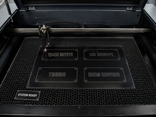 Large CO2 laser mirror engraving the black rear coating of a clear acrylic reverse engraving sheet
