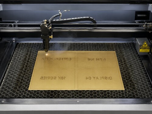 Large CO2 laser mirror engraving the champagne-gold rear coating of back-coated acrylic